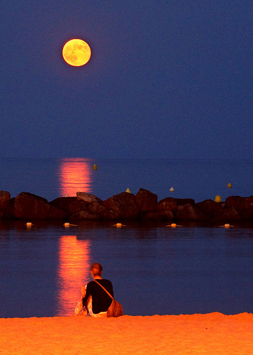 Watching the full moon rising on the beach by chris wright - hull