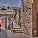 Cyclist in Gordes par C.R. Courson - Gordes 84220 Vaucluse Provence France